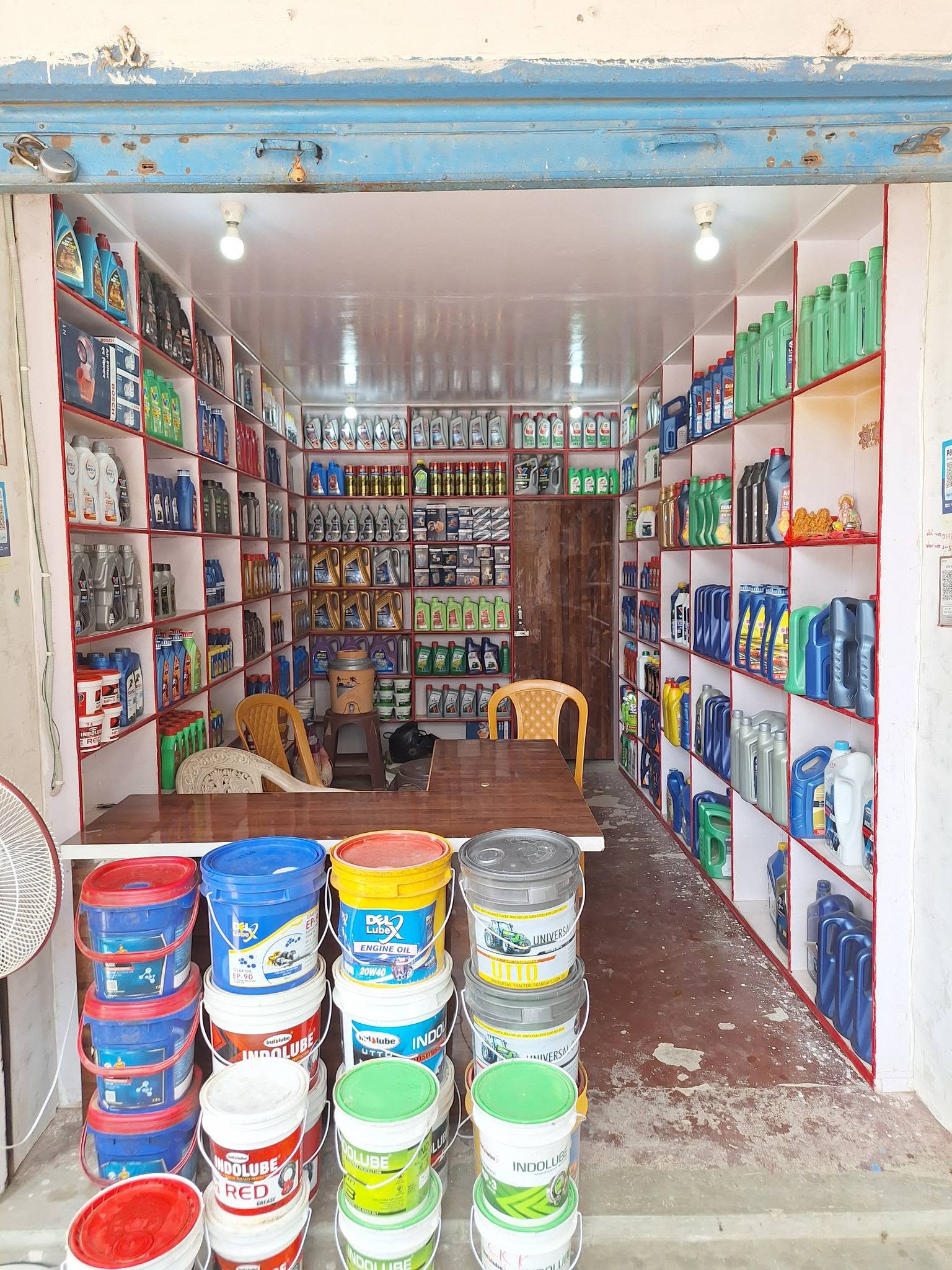 Suvidha Auto Agency shop interior with lubricants and engine oils